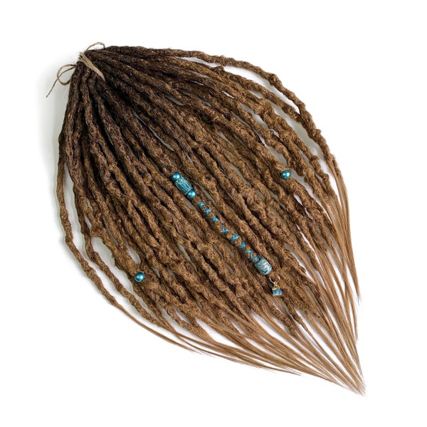 Honey brown ombré dreads done in knotty natural style, choose the root colour, decorated accents, natural styled dreadlocks.