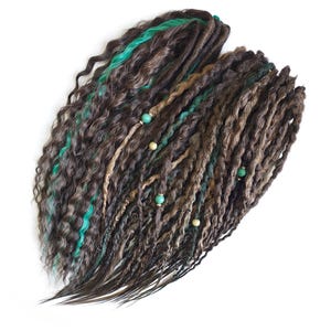 May include: Brown and green synthetic dreadlocks with green and beige beads.