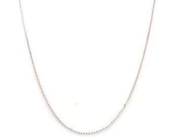 May include: A silver chain necklace with a delicate, twisted design.