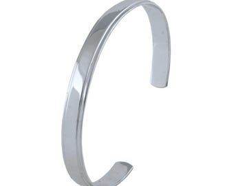May include: A silver bangle bracelet with a smooth, polished finish.
