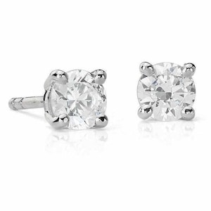 May include: A pair of silver stud earrings with a clear round gemstone in the center.