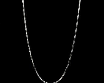 May include: A silver chain necklace with a delicate, fine link design.