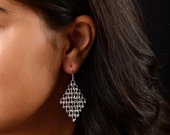 Limited Edition Platinum Earrings: Diamond Cut Dangle, Lightweight