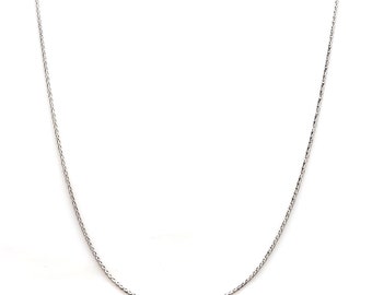 May include: A silver chain necklace with a delicate, braided design.