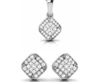 May include: A silver pendant necklace and matching earrings set with a square-shaped design featuring a cluster of small clear stones.