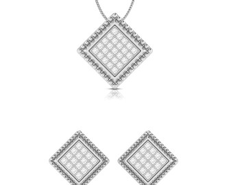 May include: A silver necklace and earrings set with a square pendant and matching earrings. The pendant and earrings are adorned with small, clear stones.