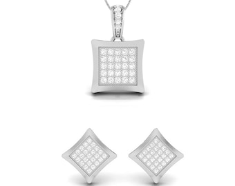 May include: A silver pendant necklace and matching earrings set with a square-shaped design. The pendant and earrings are adorned with small, clear cubic zirconia stones.