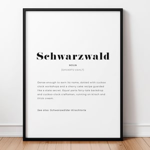 May include: A framed wall print featuring the word Schwarzwald in bold black text, followed by the noun classification, phonetic pronunciation, and a descriptive paragraph about the region, ending with a reference to Schwarzwälder Kirschtorte.