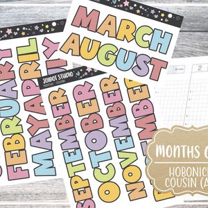 May include: Sheets of colorful planner stickers with the months of the year in large, bold letters. The stickers are in various pastel colors and are labeled "JOIBOT STUDIO". A notebook with grid paper is also visible, along with a sticker that says "MONTHS ONLY HOBONICHI COUSIN (A5)".