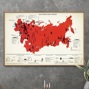 May include: A vintage-style poster depicting a map of the Soviet Union with red markings indicating military forces. The poster includes the title "Soviet Military Forces" and details about nuclear forces, tactical aircraft, ground forces, strategic defense forces, and naval forces.