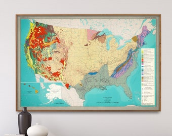 May include: A vintage-style map of the United States showing geological formations in various colors. The map is framed in a light wood frame and is hanging on a white wall above a wooden dresser.
