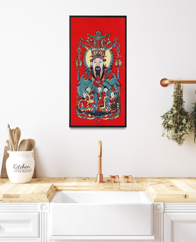 May include: A framed print of a traditional Chinese painting depicting a deity with a long beard and a crown, surrounded by smaller figures. The painting is set against a red background.