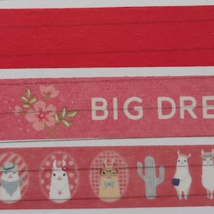 May include: Pink decorative tape with the words "BIG DREAM" and illustrations of llamas, cacti, and flowers. The tape has a red background and is suitable for crafts, scrapbooking, or adding a decorative touch to gifts.