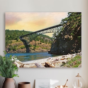 May include: A canvas print of a scenic landscape featuring a green arched bridge spanning a body of water. The bridge is surrounded by lush green trees and rocky cliffs. The sky transitions from yellow to a soft blue.