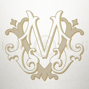 May include: A gold monogram with the letter "M" in a decorative, ornate font. The letter is surrounded by intricate floral designs.