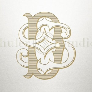 May include: A gold monogram with the letters "S" and "D" intertwined in a decorative, ornate style.
