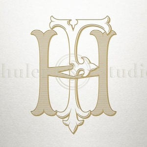 以下が含まれることがあります： 装飾的な花飾りデザインの金色のモノグラムの頭文字「H」