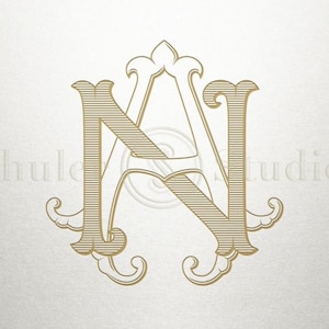 May include: A gold monogram with the letters "N" and "A" intertwined. The letters are stylized with a decorative flourish and have a striped pattern.