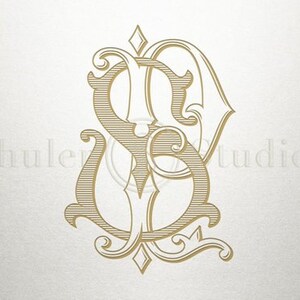 May include: A gold monogram with the letters "S" and "D" intertwined in a decorative, ornate style. The letters are surrounded by intricate flourishes and a diamond shape at the top.