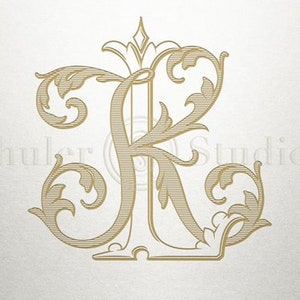 以下が含まれることがあります： 「JR」の文字が、装飾的な花柄のデザインと組み合わされた、金色のモノグラムです。