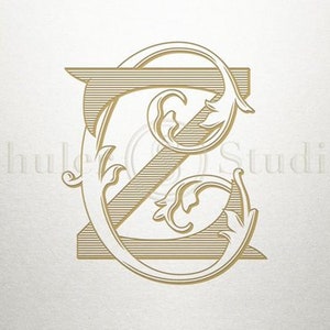 May include: A gold-colored monogram with the letter "Z" in a decorative, stylized font. The letter is surrounded by ornate flourishes and swirls.