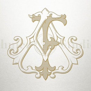 Puede incluir: Un monograma dorado con las letras A y T entrelazadas en un diseño decorativo y ornamentado.