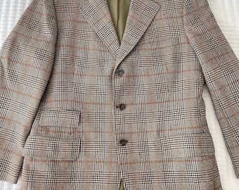 May include: A brown, black, and orange plaid blazer with a three-button closure.
