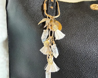 She Ascends | Aura Quartz Angel Wings Bag Charm | Evil Eye Medallion Tassels
