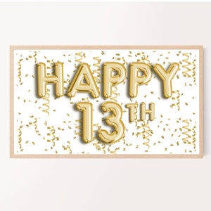 May include: A framed print with the words "HAPPY 13TH" in gold balloon letters. The background is white with gold confetti and streamers. The frame is a light wood color. A festive design for a birthday celebration.