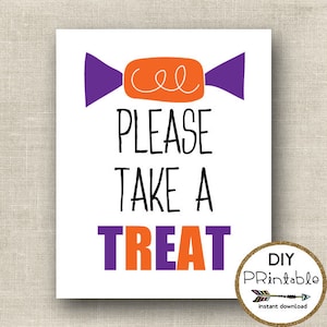 May include: A rectangular white sign featuring an orange candy graphic with purple ends and white swirl details. The text reads PLEASE TAKE A in black, followed by TREAT in alternating purple and orange letters. A circular badge says DIY PRintable.