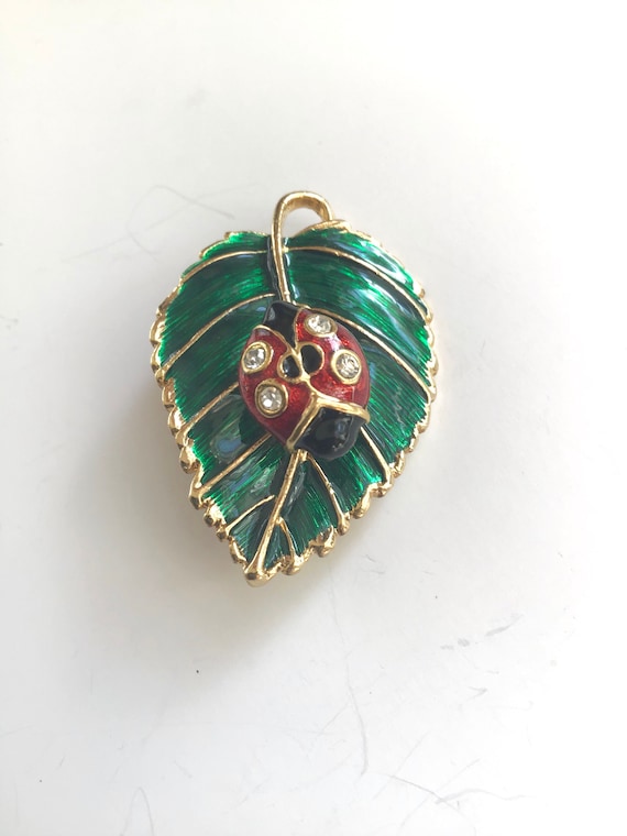 Vintage ladybug on leaf brooch enameled trembling 