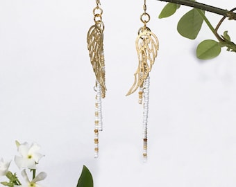 Beaded earrings. Gold feather charm. Antique glass seed bead. Handmade Lightweight Dangly Boho jewelry Long earrings Feather pendant Tribal