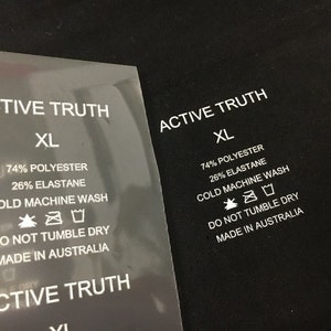 K&ouml;nnte beinhalten: Wei&szlig;es Pflegeetikett mit schwarzem Text, der "ACTIVE TRUTH XL 74% POLYESTER 26% ELASTANE COLD MACHINE WASH DO NOT TUMBLE DRY MADE IN AUSTRALIA" lautet, mit Symbolen f&uuml;r Waschanweisungen.