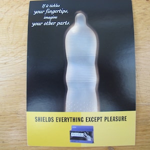 Vintage 1990s Textured Shields Condoms Advertising Postcard