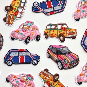 May include: A collection of 11 embroidered iron-on patches featuring various colourful mini cooper cars with different designs. The patches are perfect for adding a unique touch to clothing, bags, or other fabric items.