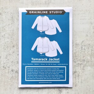 May include: A blue and white sewing pattern for a Tamarack Jacket. The pattern includes two views of the jacket, one with a button-up front and one with a zipper front. The pattern is for sizes 14-30 D-Cup and is labelled as intermediate difficulty.