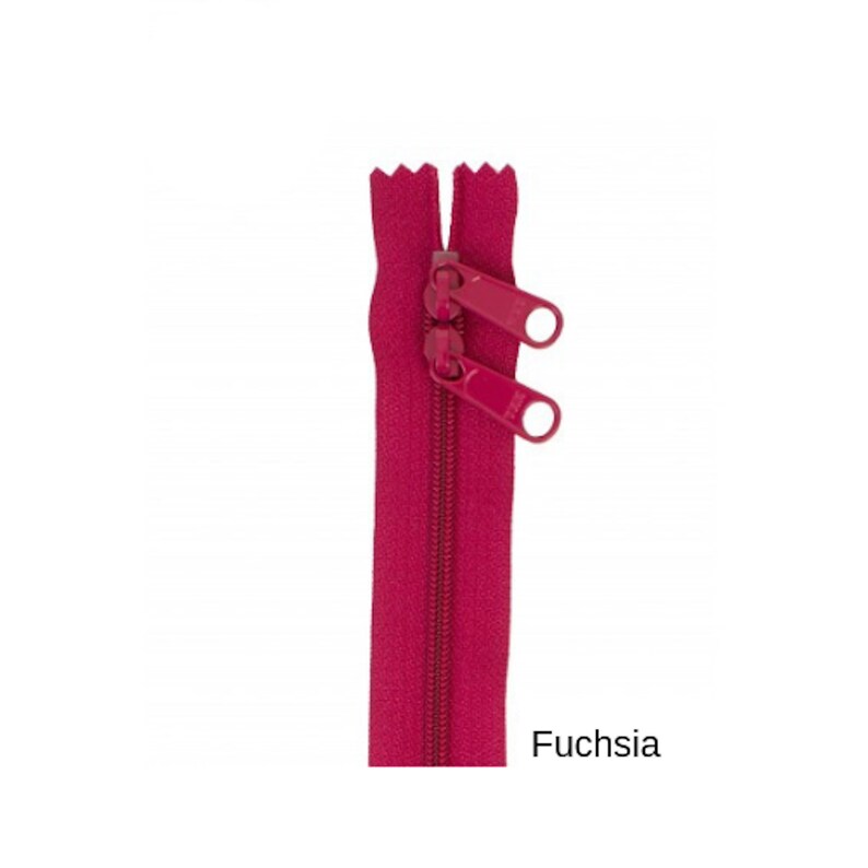 May include: A fuchsia zipper with two pull tabs.