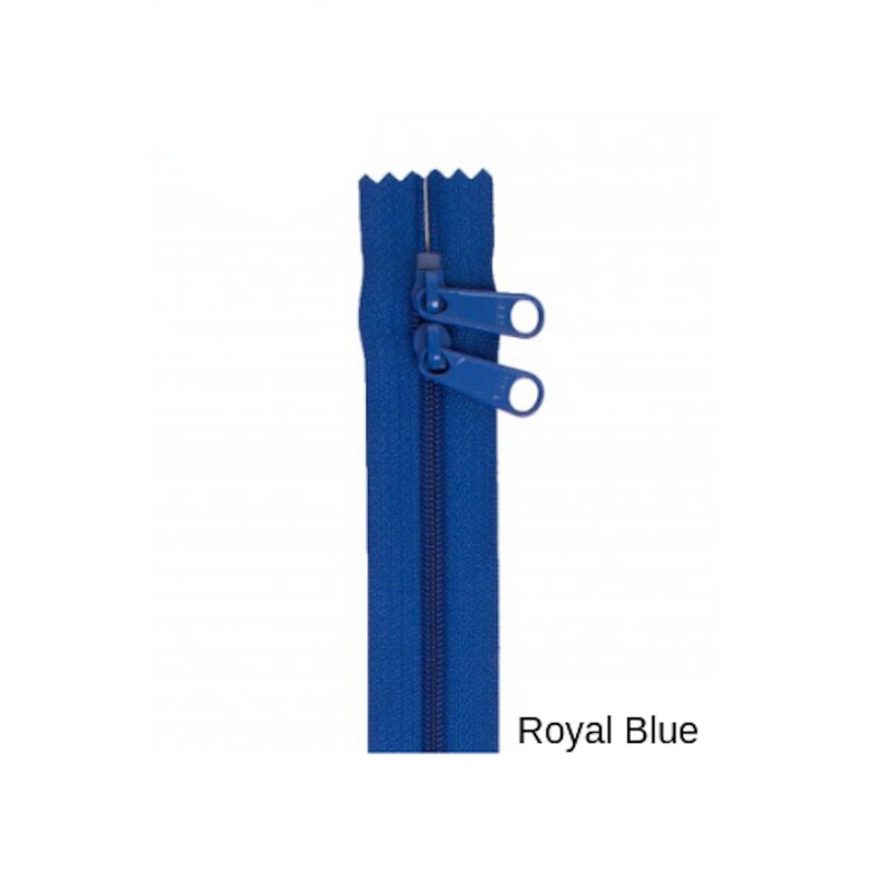 May include: A royal blue zipper with two pull tabs. The zipper is closed and the pull tabs are at the top of the zipper.