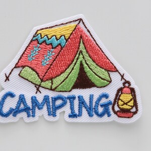 May include: Embroidered patch with a colorful cartoon tent and a lantern, with the word "CAMPING" in blue lettering.