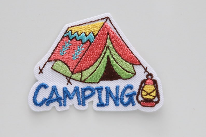 May include: Embroidered patch with a colorful cartoon tent and a lantern, with the word "CAMPING" in blue lettering.