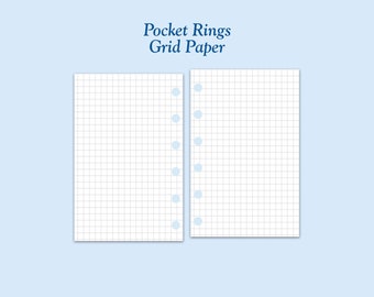 May include: Two blank grid paper pages with holes punched along the right edge. The pages are white with light blue lines and holes.