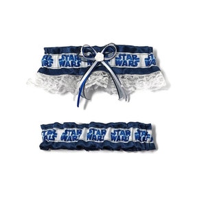 May include: Two-piece set of blue and white Star Wars themed garters. The top garter has a white lace trim and a bow with a small white rose. The Star Wars text is printed in white on a blue background.