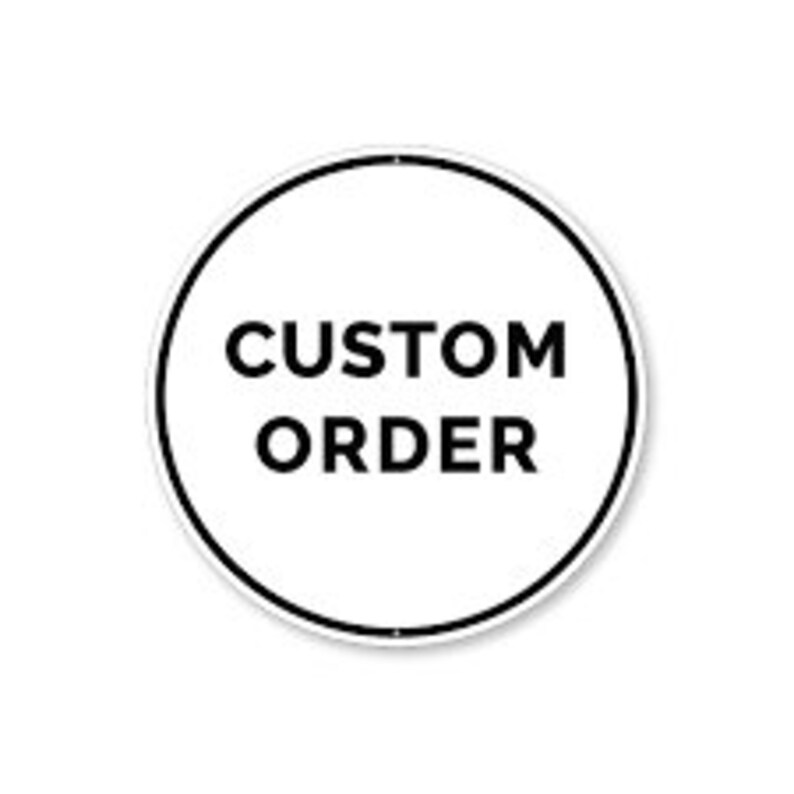May include: A white round sign with a black border and the text "CUSTOM ORDER" in black.