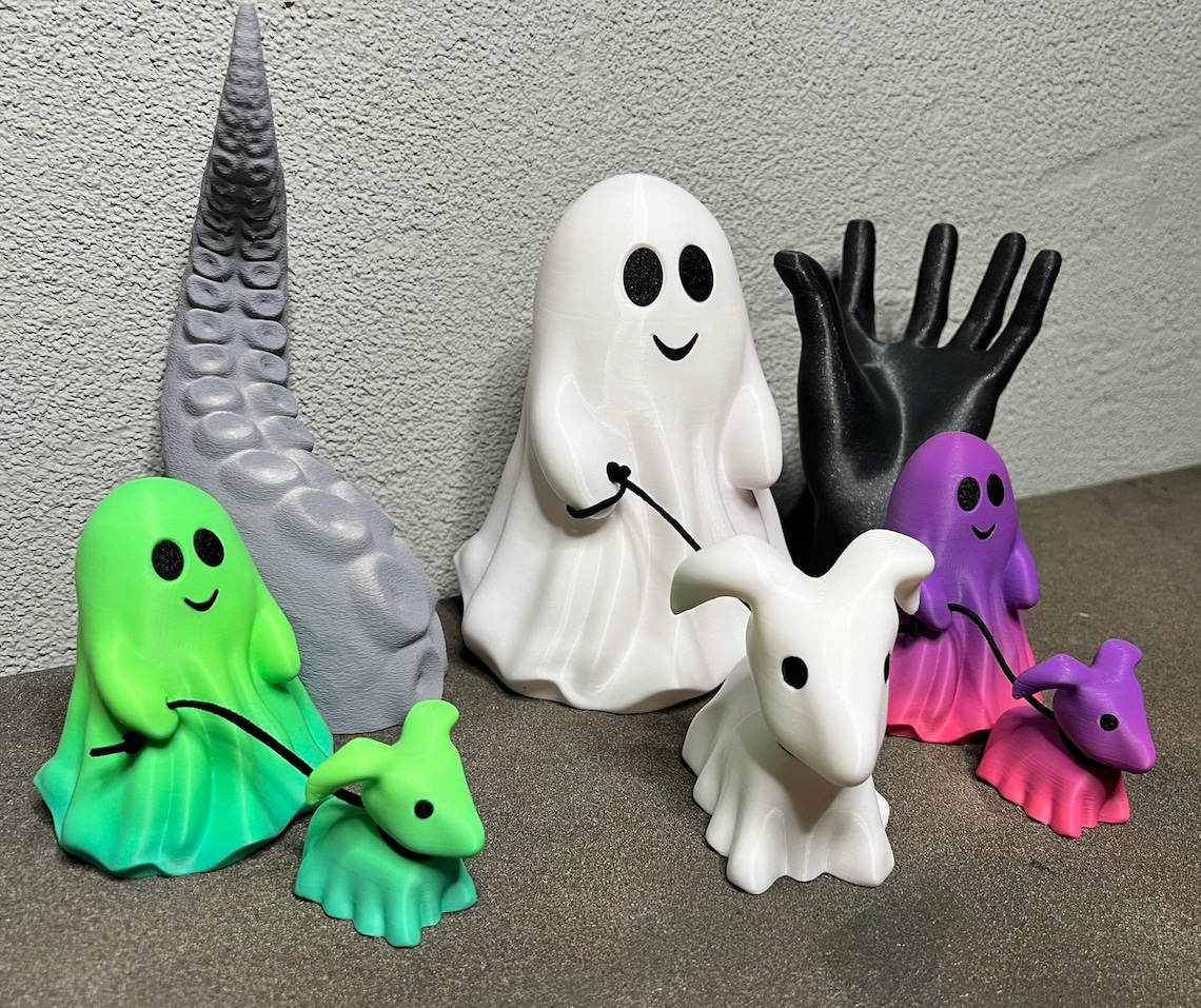 Ghost Walking Dog figurines in white, green, and purple ombre.