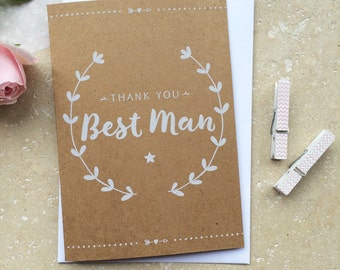 May include: A brown card with a white wreath and the text "Thank You Best Man" inside the wreath.
