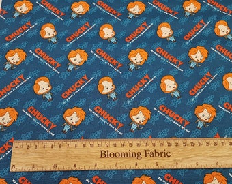 May include: Blue fabric with a repeating pattern of a cartoon character named Chucky. The character is red-haired and wearing blue overalls. The text "He wants you as a best friend" is repeated throughout the fabric.