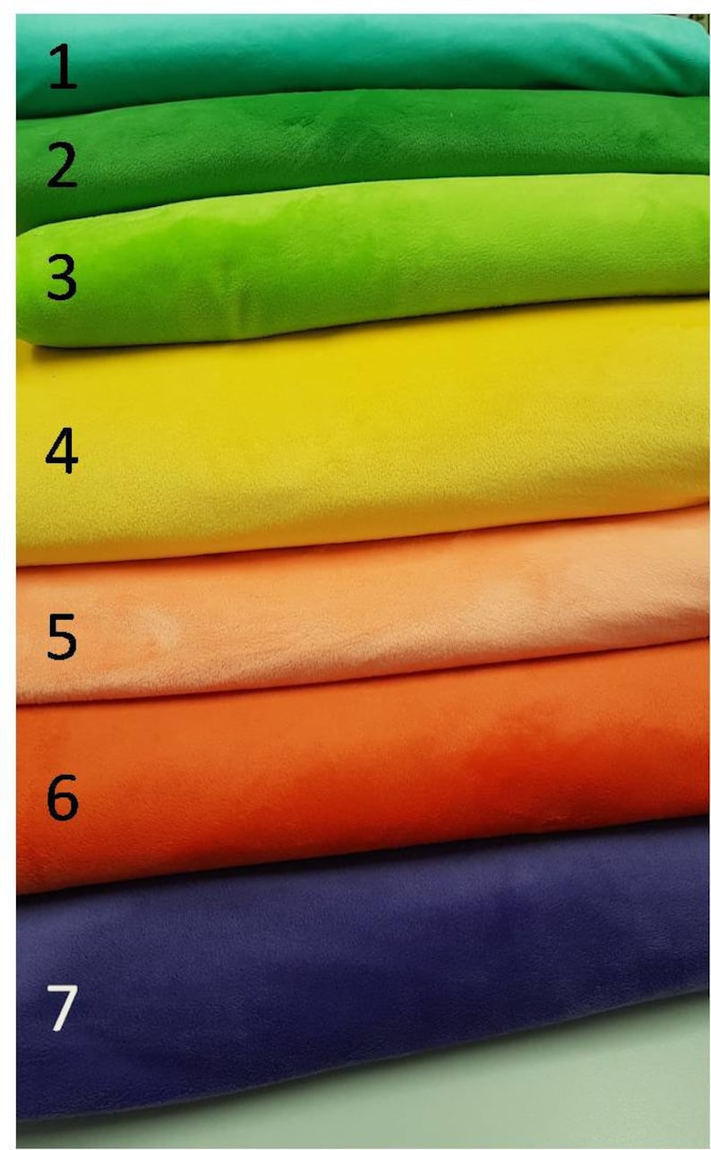 May include: Seven fabric swatches in different colours, stacked on top of each other. The swatches are numbered 1 through 7. The colours are green, lime green, yellow, peach, orange, purple, and blue.