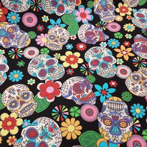 May include: Black fabric with a repeating pattern of colorful sugar skulls and flowers. The skulls are decorated with intricate details and have a whimsical, festive feel.