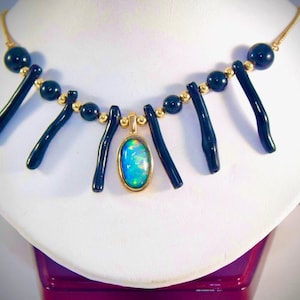 10 crt opal with black coral and 14k yellow gold