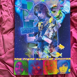 May include: A film poster for "The Fight Against Phones" by David Leo. The poster features a person with long dark hair wearing a colorful shirt and holding a silver laptop. The poster has a blue and purple background with stars and fish. The bottom of the poster features four faces in colorful squares.